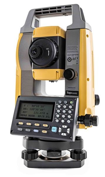 Surveyor operating Topcon GM-55 in topographic survey